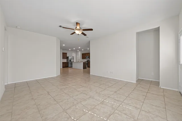 a view of an empty room with a window