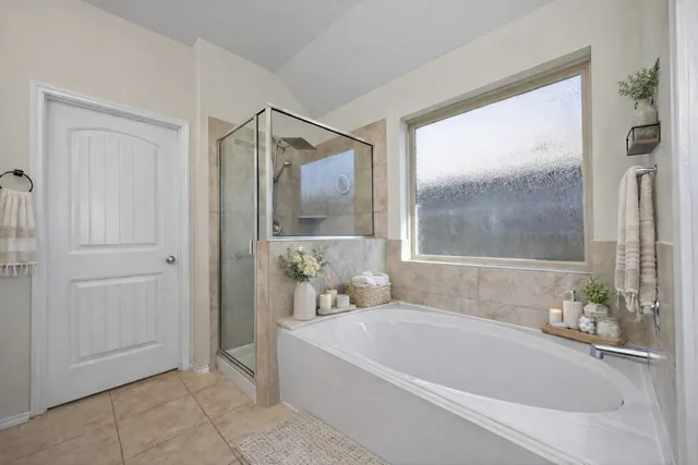 a white bath tub sitting next to a bathroom