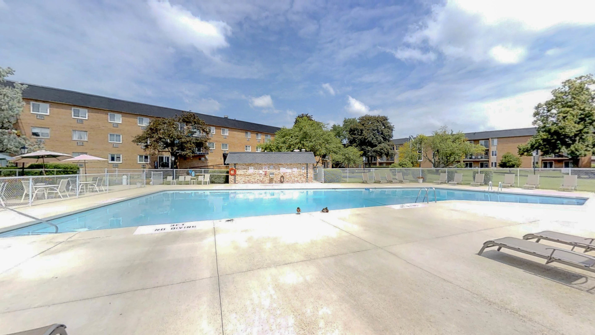 1041 North Mill Street, Unit 203 Naperville, IL 60563 - Photo 17 of 18 a view of a swimming pool and a yard