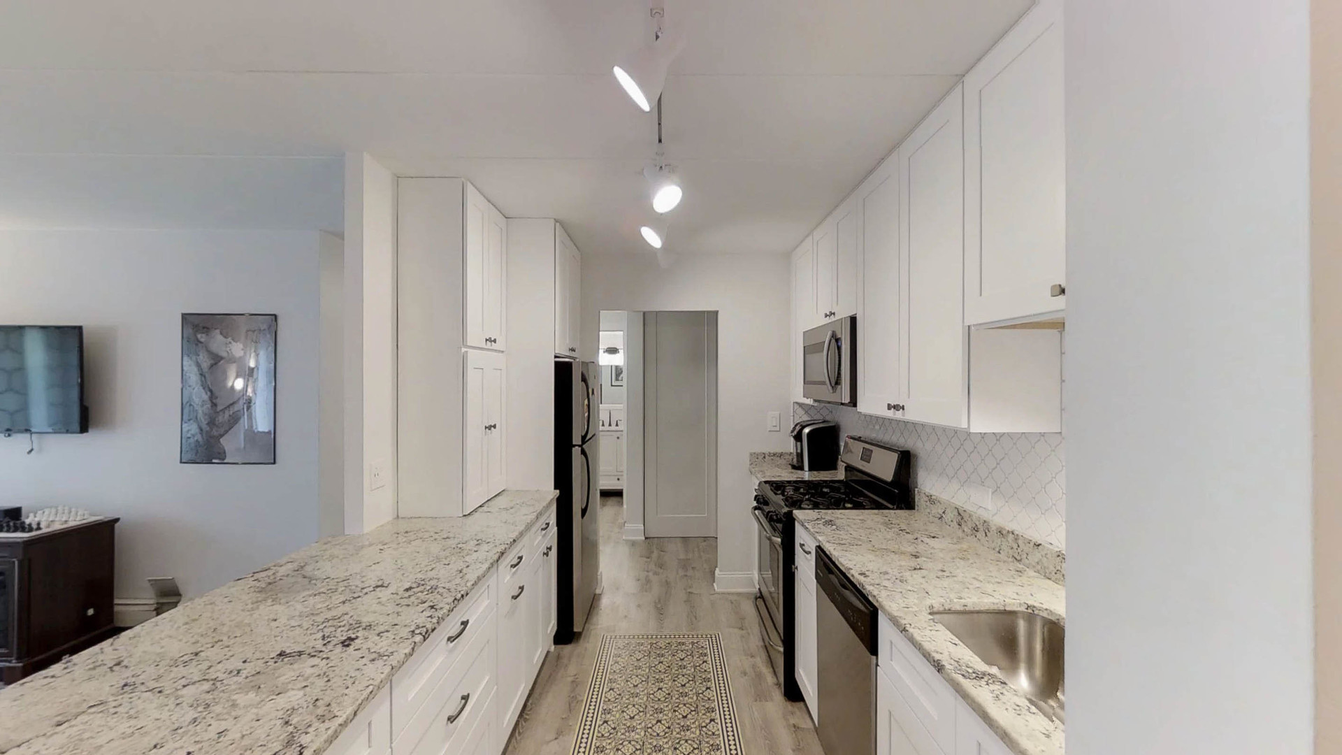 1041 North Mill Street, Unit 203 Naperville, IL 60563 - Photo 9 of 18 a kitchen with a stove and a refrigerator