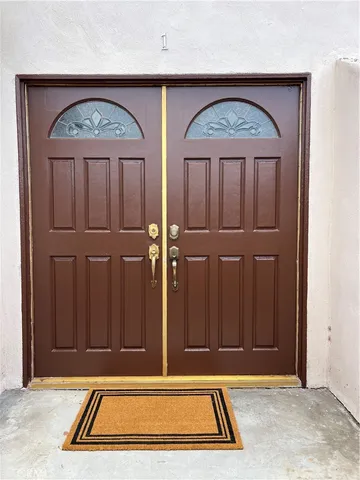 a front view of a house with stairs