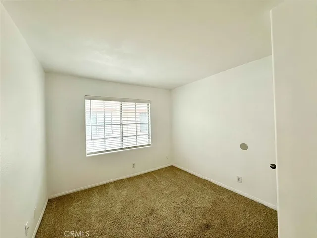 an empty room with closet area