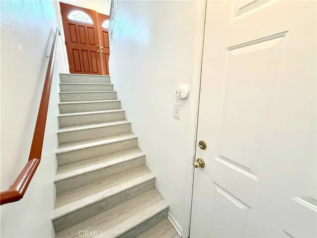 a living room with a bench and dryer