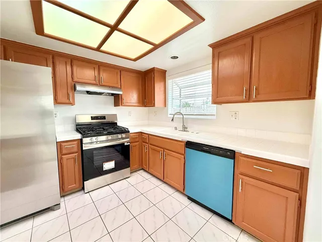 a close view of a stove a microwave and cabinets