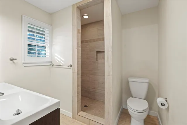 a bathroom with a toilet and a sink