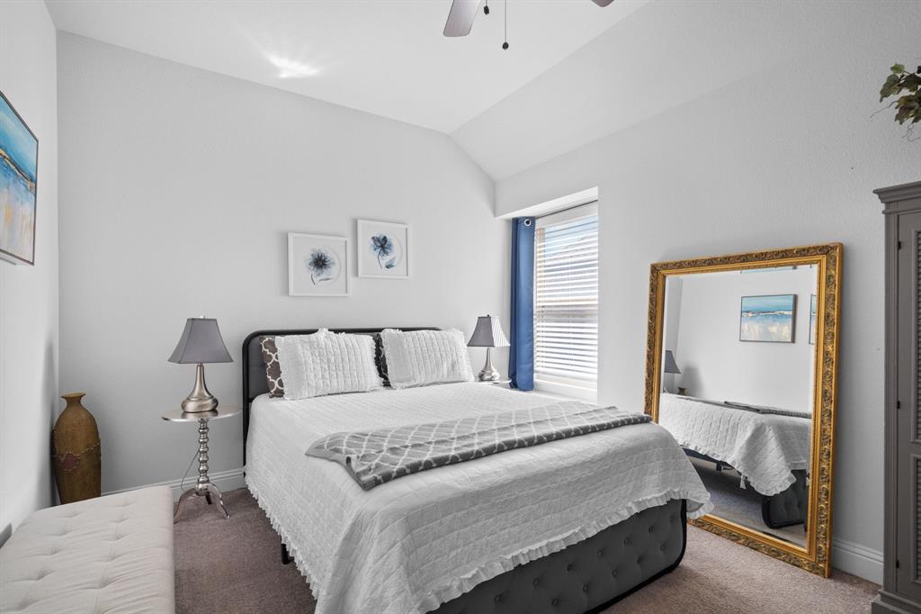 3724 Ranchers Ridge Krum, TX 76249 - Photo 21 of 32 a bedroom with a bed and a painting on the wall