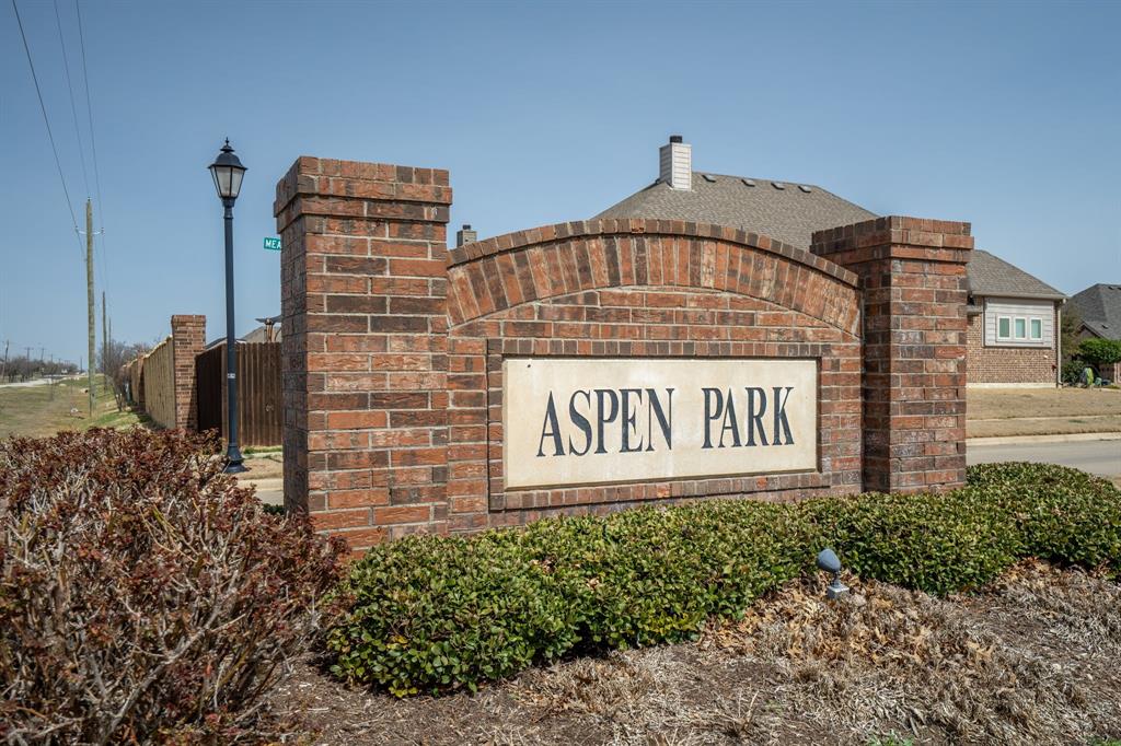 3724 Ranchers Ridge Krum, TX 76249 - Photo 29 of 32 a sign on the side of a building