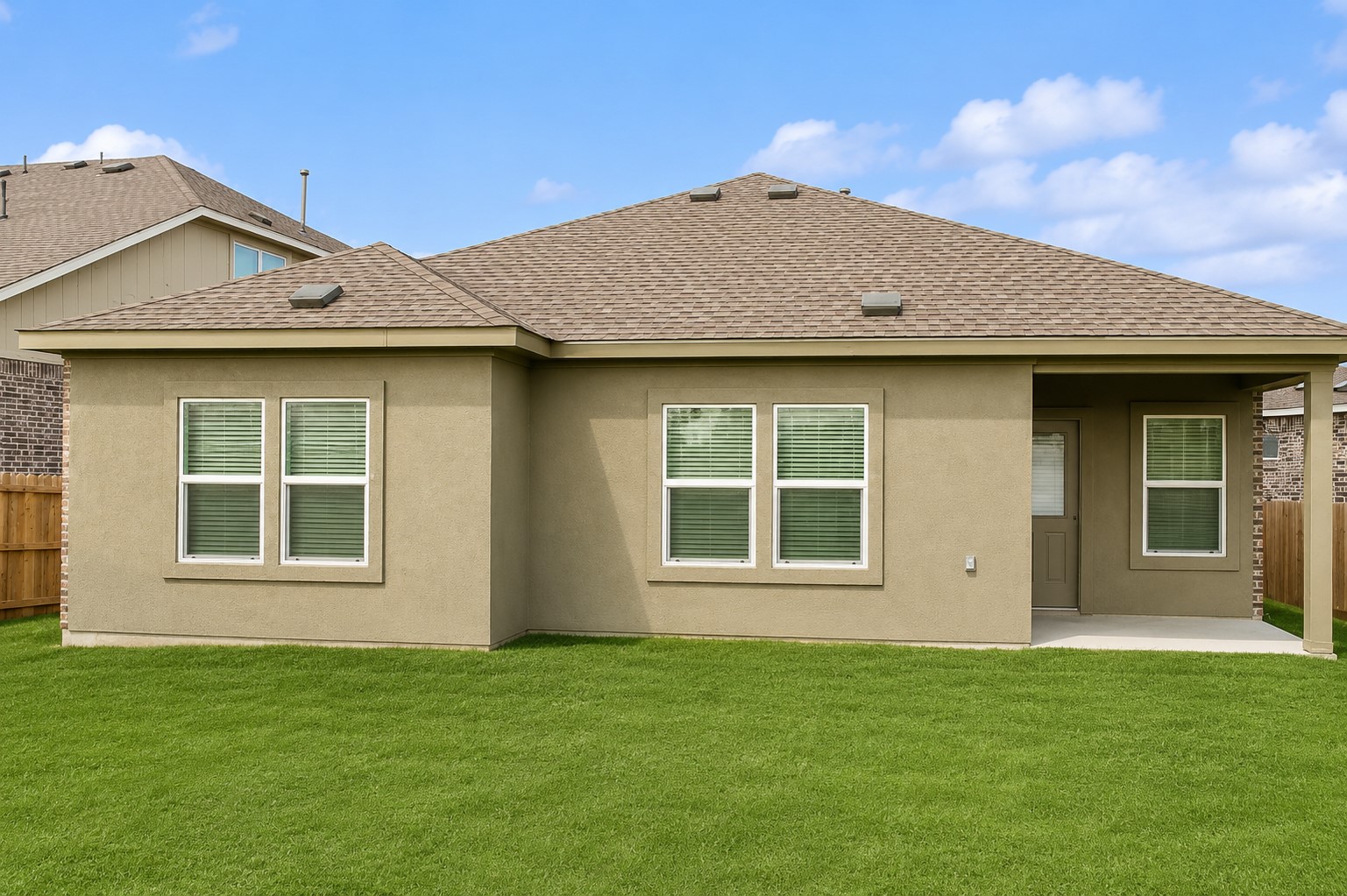 828 Mallow Road Leander, TX 78641 - Photo 13 of 14 A well-maintained lawn stretches behind this inviting home, framed by sturdy fencing.