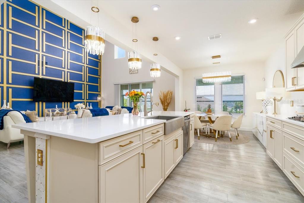 1296 Waterview Ridge Circle Apopka, FL 32703 - Photo 26 of 60 a kitchen with counter top space sink and living room