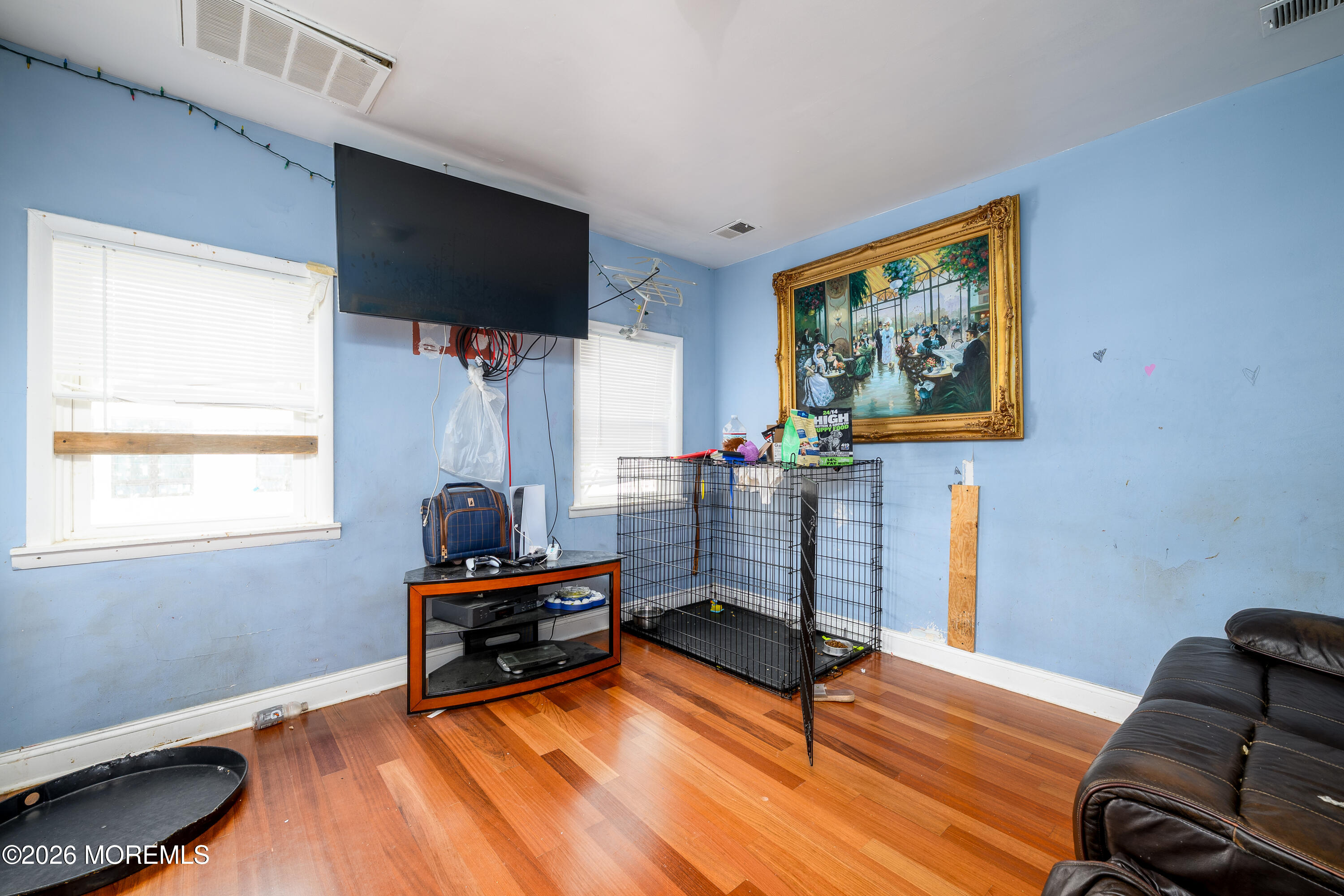 2nd Avenue, Unit 2 Long Branch, NJ 07740 - Photo 9 of 32 a living room with furniture and a flat screen tv