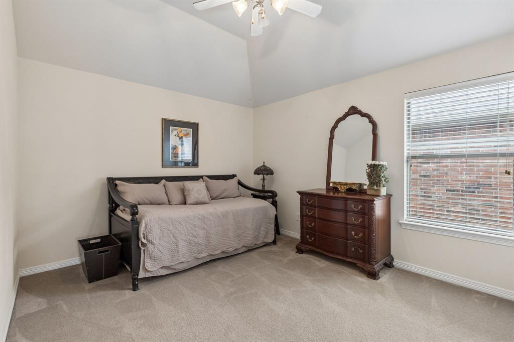 960 Remuda Road Frisco, TX 75033 - Photo 25 of 39 Room featuring vaulted ceilings, neutral wall tones, and plush carpet flooring
