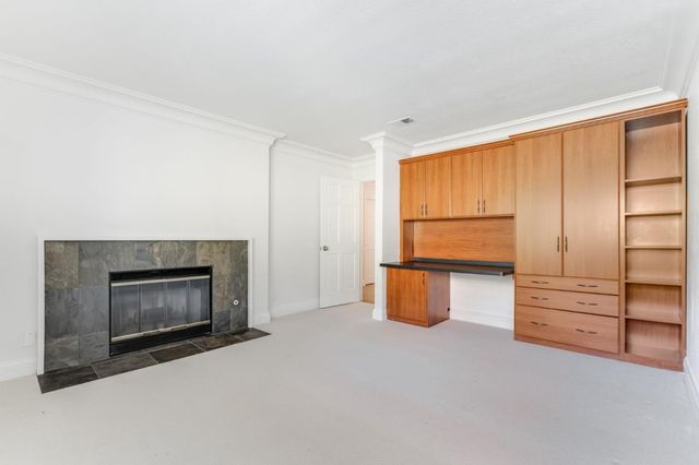 a room with furniture and a fireplace