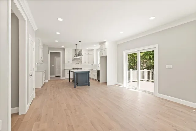 a view of a kitchen with large windows