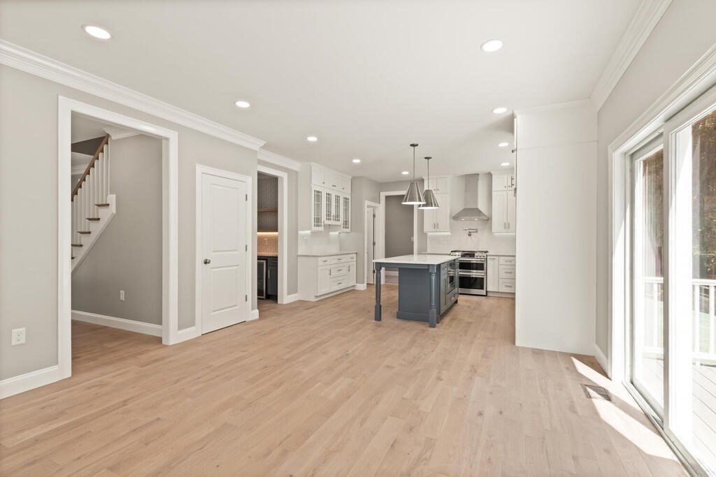 15 Lawler Lane Stoughton, MA 02072 - Photo 16 of 41 a view of kitchen with stainless steel appliances kitchen island refrigerator stove and wooden floor