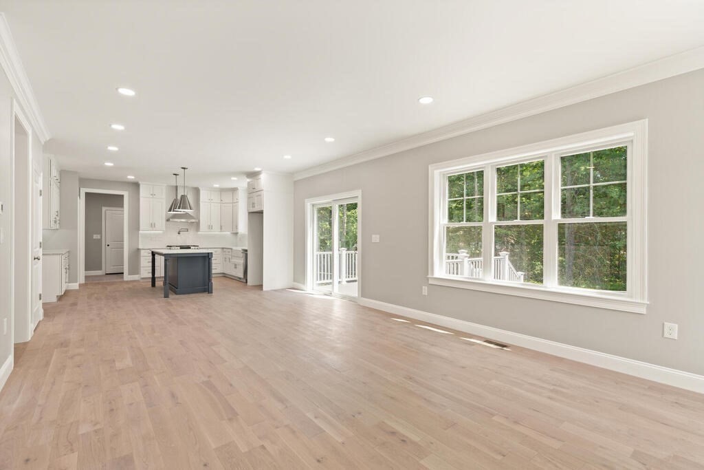 15 Lawler Lane Stoughton, MA 02072 - Photo 17 of 41 an empty room with wooden floor and windows
