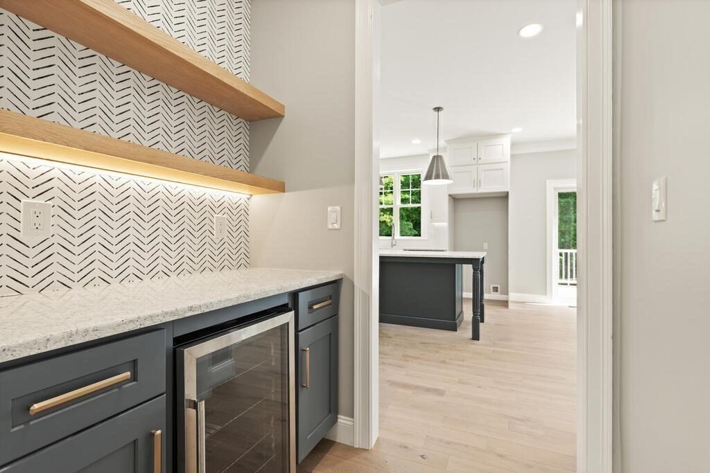 15 Lawler Lane Stoughton, MA 02072 - Photo 18 of 41 a kitchen with a sink cabinets and a wooden floor