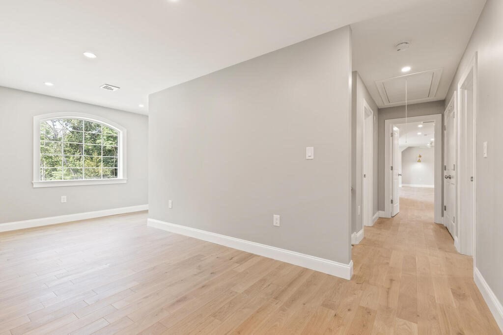 15 Lawler Lane Stoughton, MA 02072 - Photo 20 of 41 wooden floor in an empty room with a window