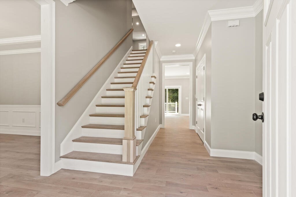 15 Lawler Lane Stoughton, MA 02072 - Photo 2 of 41 a view of a hallway with wooden floor and entryway