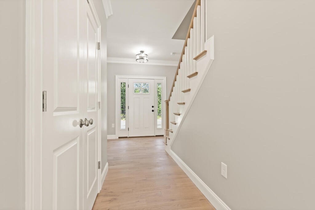 15 Lawler Lane Stoughton, MA 02072 - Photo 24 of 41 a view of a hallway with wooden floor and entryway