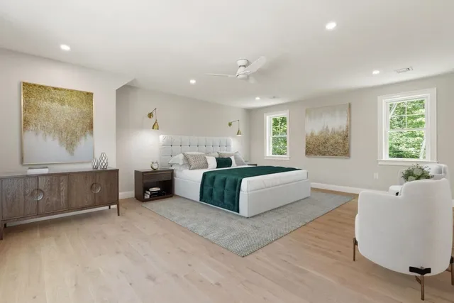 a spacious bedroom with a large bed and a couch