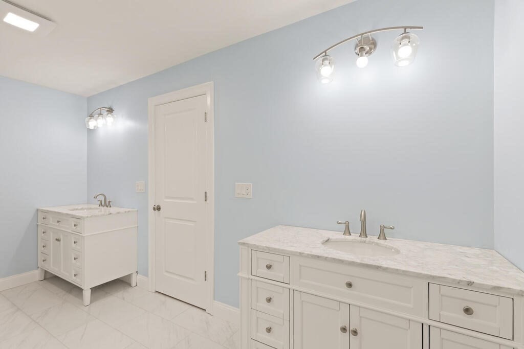 15 Lawler Lane Stoughton, MA 02072 - Photo 29 of 41 a bathroom with a double vanity sink and mirror