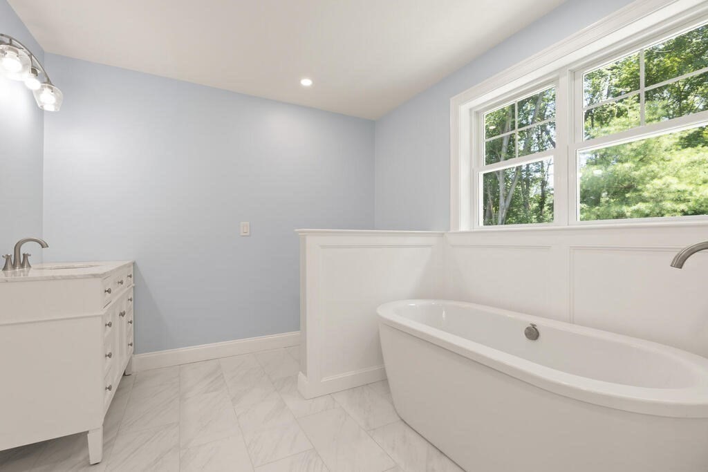 15 Lawler Lane Stoughton, MA 02072 - Photo 30 of 41 a white bath tub sitting next to a white sink