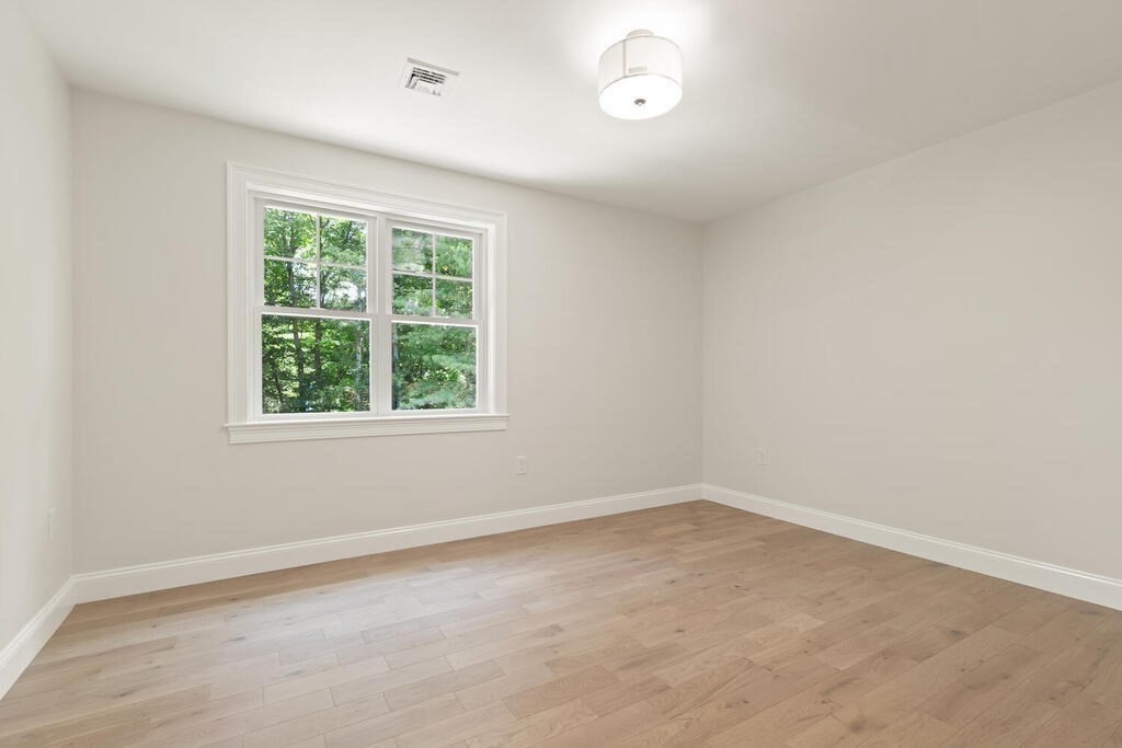 15 Lawler Lane Stoughton, MA 02072 - Photo 33 of 41 an empty room with a window