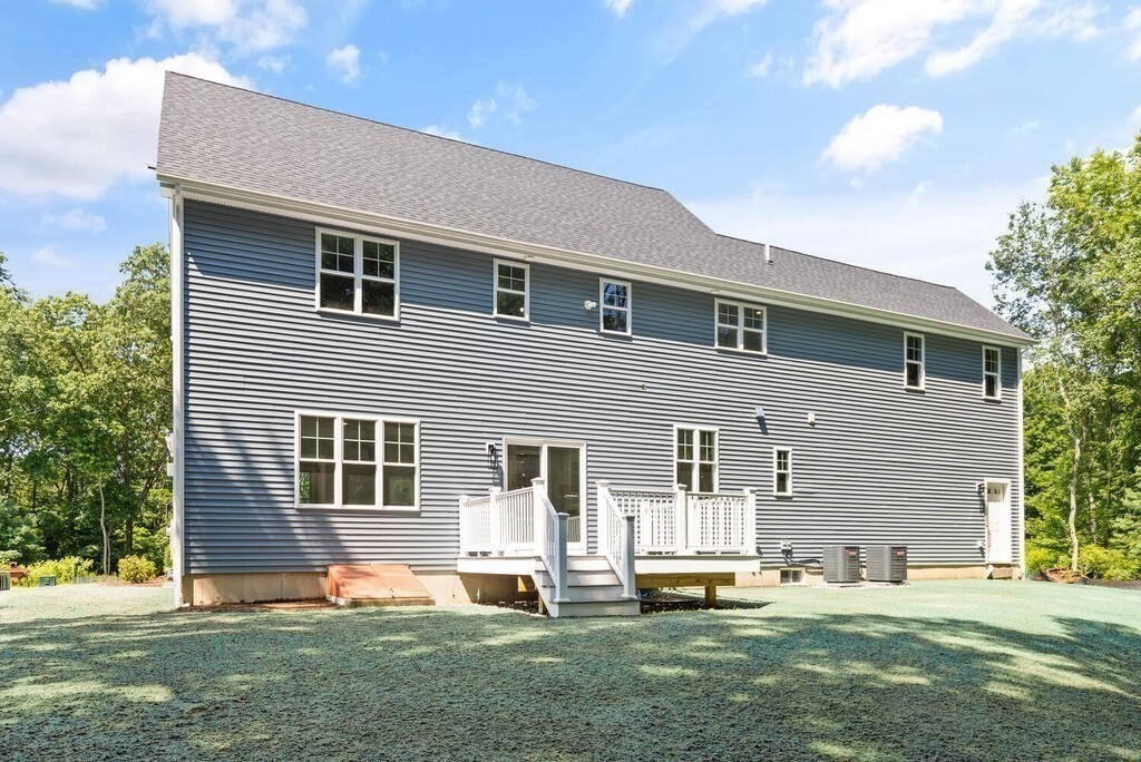 15 Lawler Lane Stoughton, MA 02072 - Photo 39 of 41 a backyard of a house with wooden floor and fence
