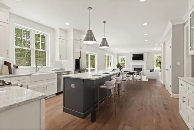 a view of living room with granite countertop furniture and a large window