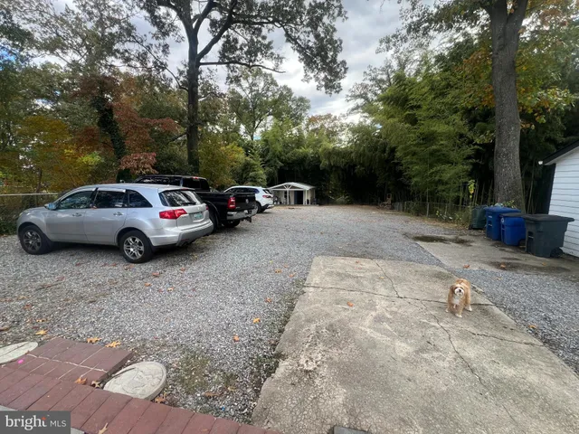 a view of street with parked cars