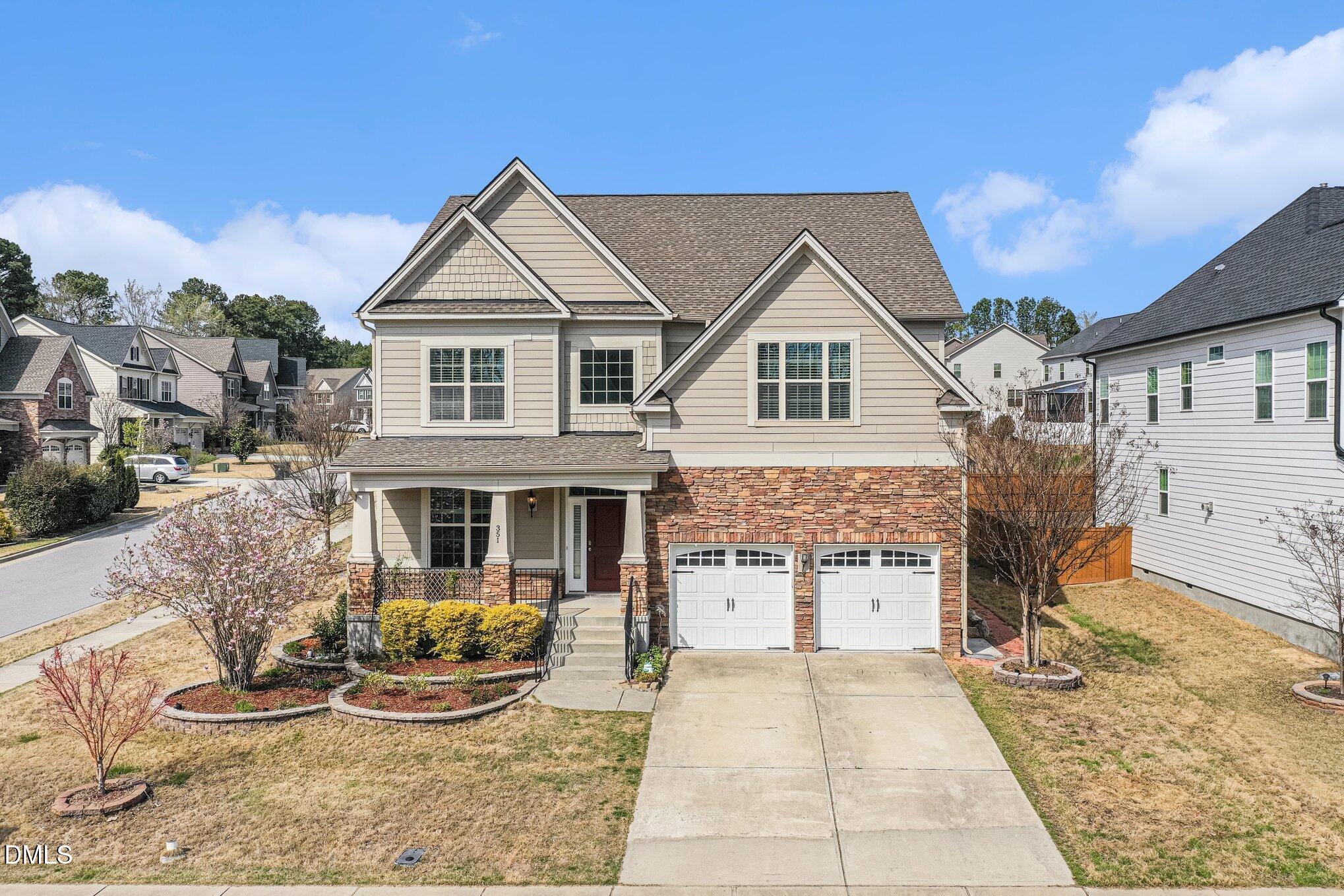 351 Gartrell Way Cary, NC 27519 - Photo 4 of 51 a front view of a house with garden