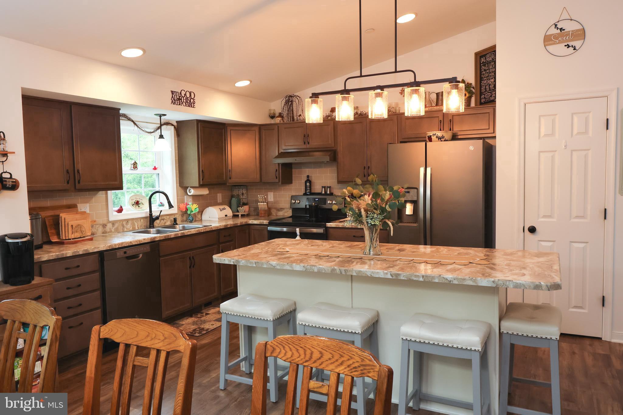 16919 Shaffer Road Sharpsburg, MD 21782 - Photo 11 of 58 a kitchen with a table chairs sink and cabinets