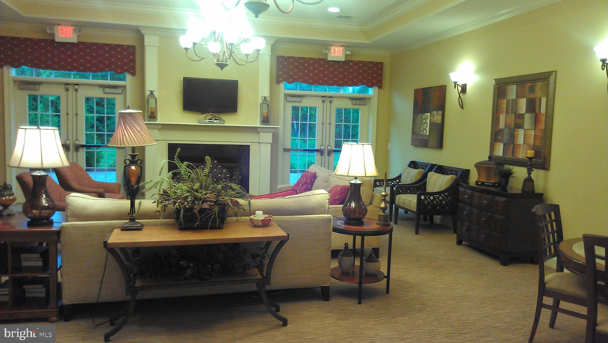 931 Timberlake Drive Ewing, NJ 08618 - Photo 11 of 16 a living room with furniture a fireplace and a potted plant