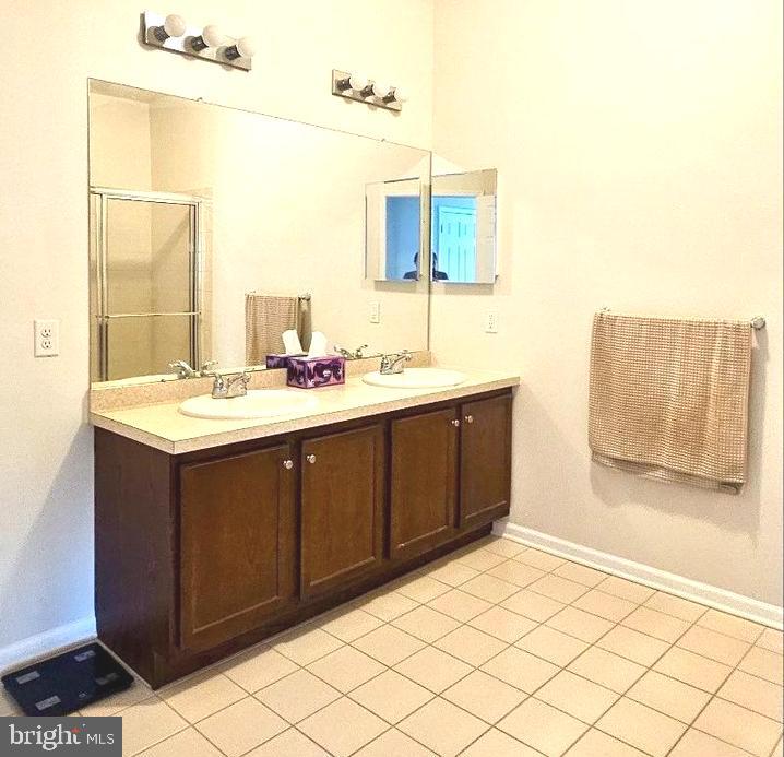 931 Timberlake Drive Ewing, NJ 08618 - Photo 5 of 16 a bathroom with a double vanity sink mirror and