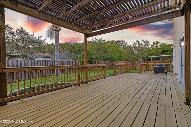 a view of a balcony with wooden floor