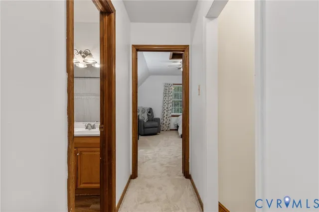 a view of a bathroom from a hallway