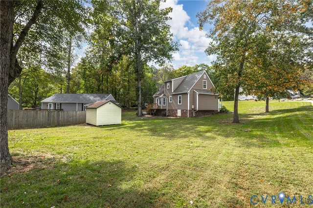 a house with huge green field in front of it