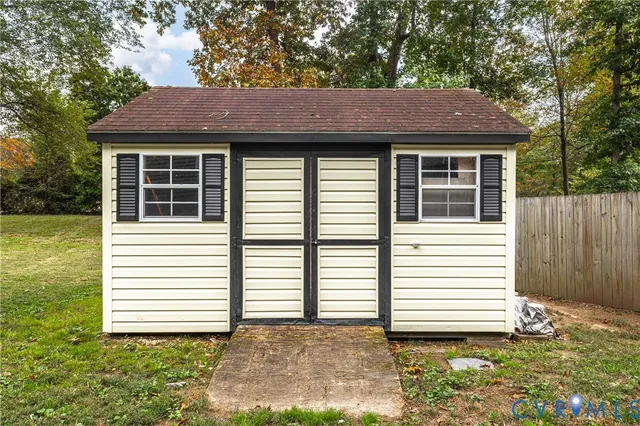 a view of a house with a yard and garage