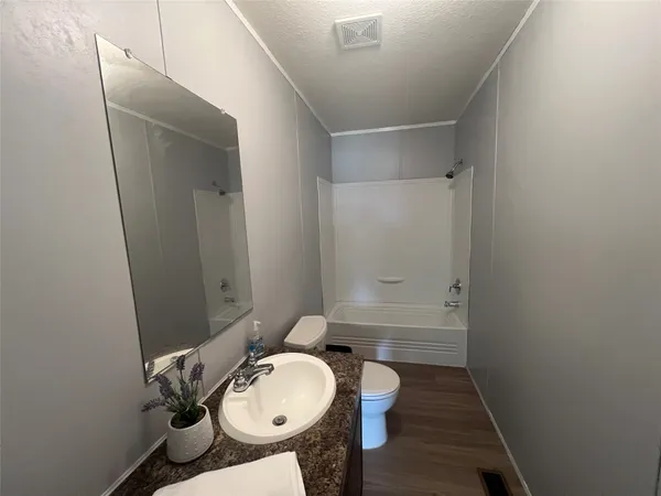 a view of a swimming pool and trees in the background