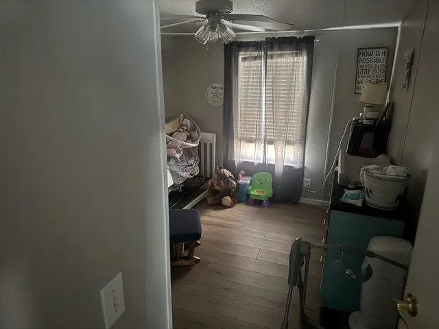 a kitchen with stainless steel appliances granite countertop a refrigerator a stove and a sink