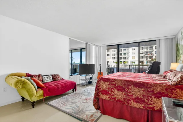 a bedroom with furniture and a window