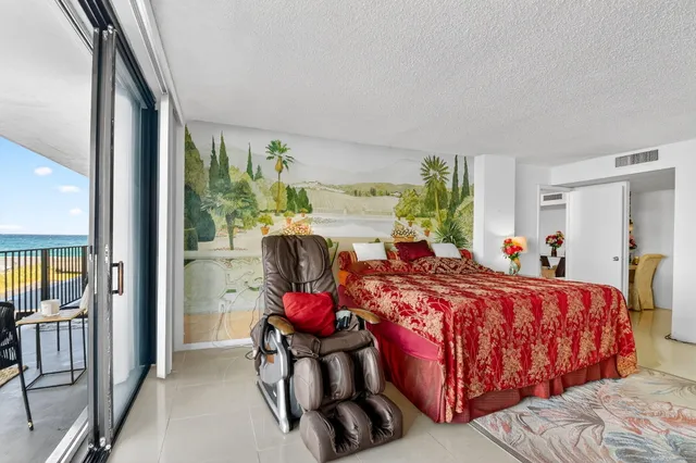 a bedroom with furniture and a chandelier
