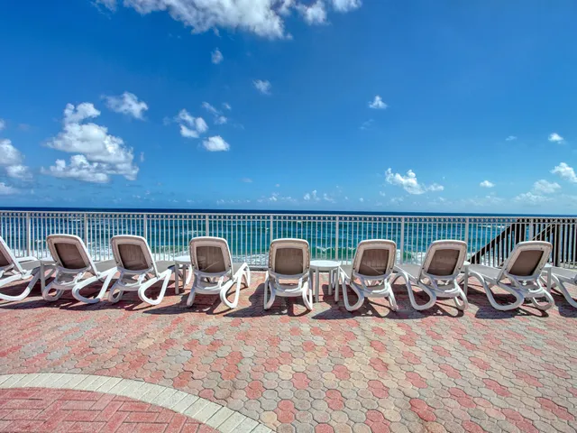 a view of a chairs and tables in the terrace