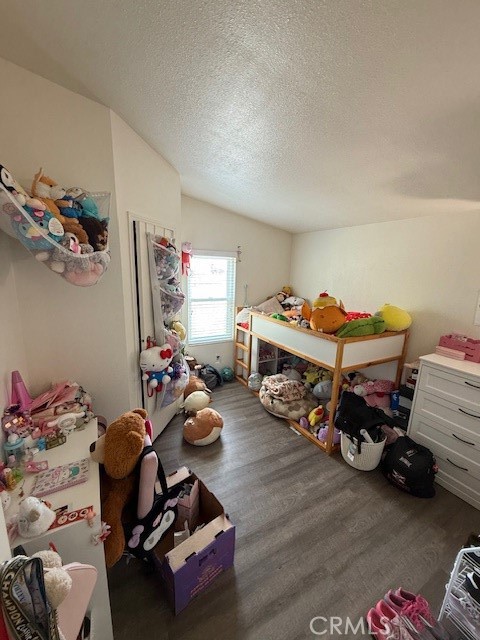 24260 Minton Road Homeland, CA 92548 - Photo 12 of 23 a car room with furniture and a wooden floor