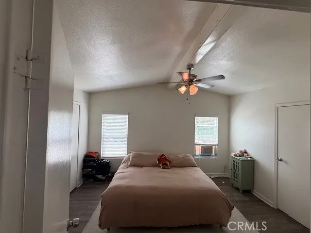 a bedroom with bed and window