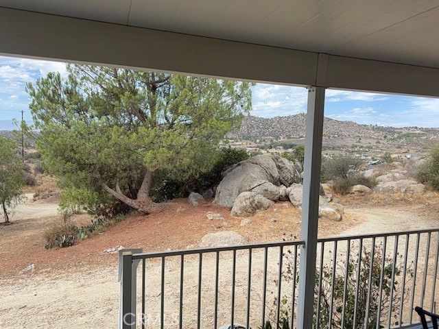 24260 Minton Road Homeland, CA 92548 - Photo 19 of 23 a view of a balcony with wooden floor