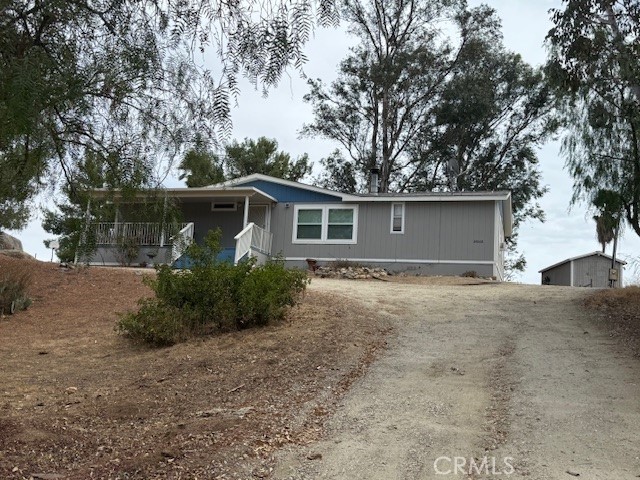 24260 Minton Road Homeland, CA 92548 - Photo 2 of 23 front view of house with a yard