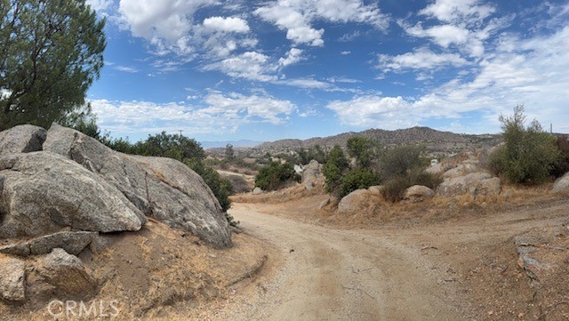 24260 Minton Road Homeland, CA 92548 - Photo 22 of 23 a view of a dry yard with lots of green space