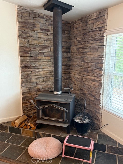 24260 Minton Road Homeland, CA 92548 - Photo 8 of 23 a room with a fireplace and a table