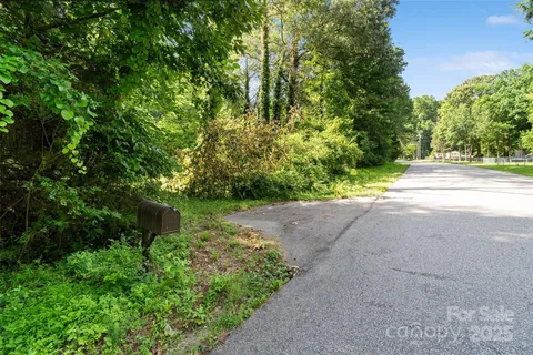 a view of a street with a trees